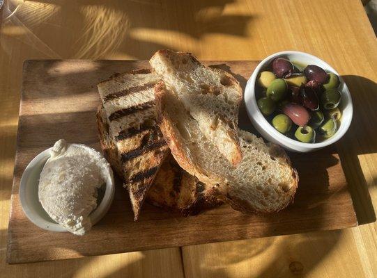 Snack board with marinated olives (delicious!) and grilled sourdough & wine butter