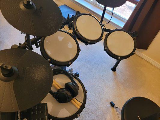 My Alesis Nitro max 8-piece electronic drum set. I love it.