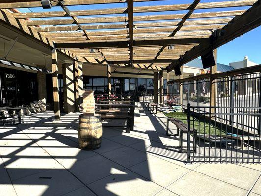 Patio Area with Rollup Garage Doors, TVs and Cornhole Games