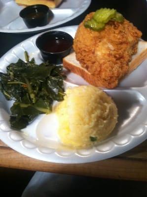 Nashville hot chicken platter with grits and collards