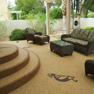 A photograph of a concrete patio with a Pebble Stone overlay.  This deck was originally coated with kool deck...