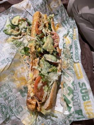 Pictured is what is supposed to be a chicken bacon footlong in Italian herbs & cheese bread with all of the veggies. Disgustingly made.