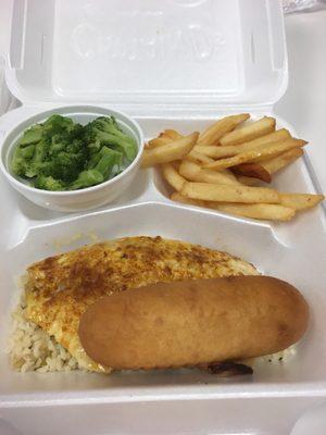 Grilled Tilapia meal over rice with a breadstick with broccoli and French fries as a side