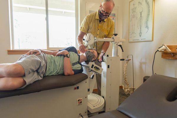 Dr. Gordon using an Atlas Chiropractic treatment for a patient