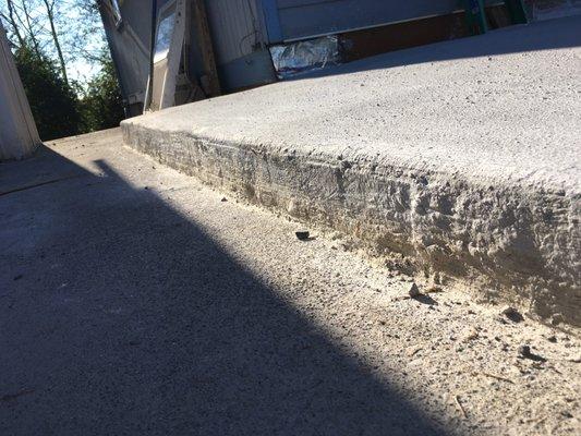 The top of the concrete slab looks just like this. They even went over this step face with more concrete and it still looks like this.