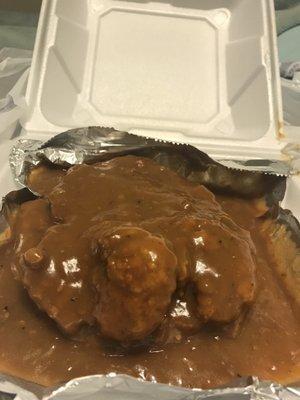 Smothered pork chops and gravy with two orders of macaroni and cheese