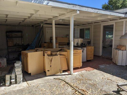 Old kitchen cabinets have been uninstalled to be donated.