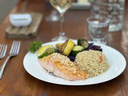 King Salmon with orange citrus glaze & toasted macadamia nuts with rice and grilled vegetables.