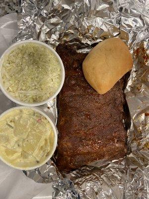 Rib plate with potato salad and coleslaw.