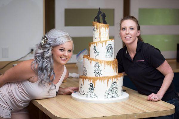 http://www.misssarascakery.com/wedding-cakes.html Hand sketched Disney Themed Wedding Cake.  Topsy Turvy with Golden Pixie Dust. Edible cake