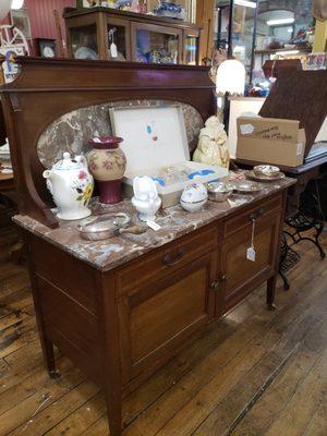 Lovely marble top buffet side board.