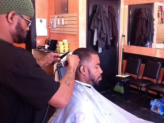 Dwele cutting a tight fade