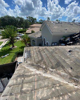 Tile roof tear off in progress