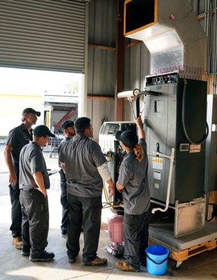 Air & Energy technicians going over new Kohler Generator installation training