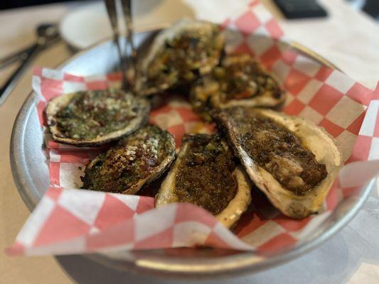 Trio of grilled oysters.