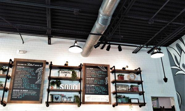 This is the right side of the menu board and it shows brews, teas, and specialty drinks.