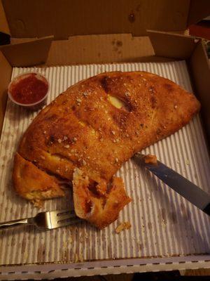 Calzone with pepperoni and ham. Omg look how big this thing is.