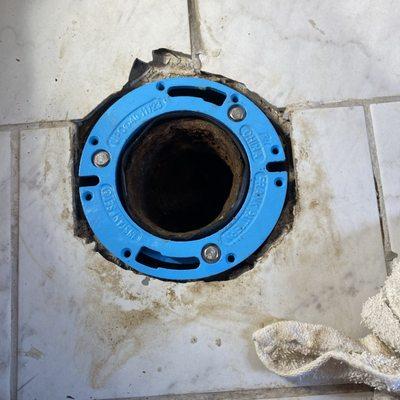 toilet flange repair before waxing and bolts are installed