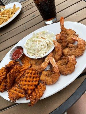 Fried shrimp with sweet potato fries.