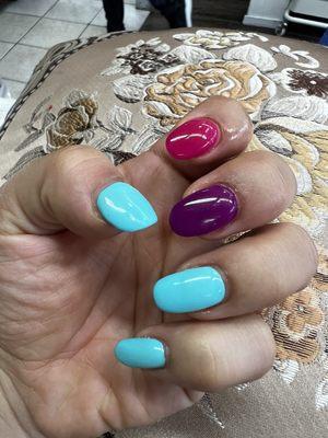 Two repaired acrylic nails, pink and purple!