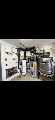 Mechanical room that includes a radiant heating/cooling system, domestic hot water and SETS secondary storage tank.