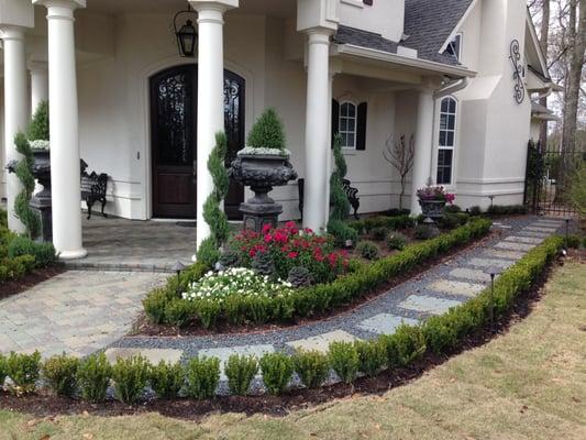 This new walkway with 24" cut stone surrounded with black gravel gave a great new look and very functional.  