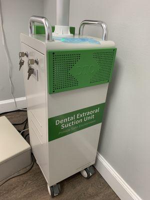 Dental Suction unit. It "sucks in" any aerosols created while cleaning teeth.