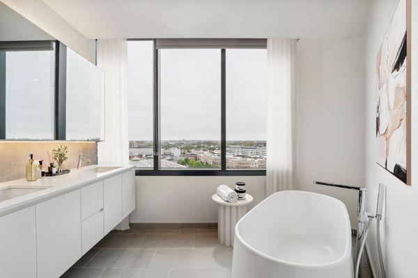 Enjoy bathrooms with a large double vanity and a captivating view