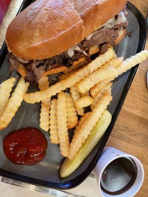 French Dip sandwich. I upgraded to fries instead of potato chips. Au jus dip is in the small white cup at lower right corner of photo. Yum!