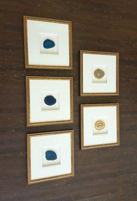 Shadow boxes display agate for a wall collage.  Lifted mattes create depth for viewing interest.