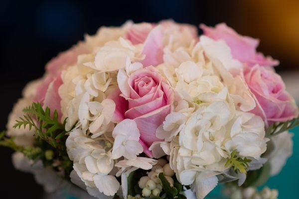 Fun and fabulous, this wedding bouquet features bubblegum pink roses, nestled in clouds of white hydrangeas.