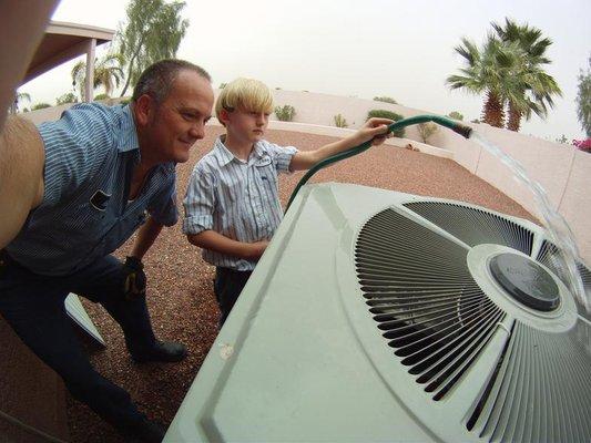 Third generation AC repair helping out on the job.