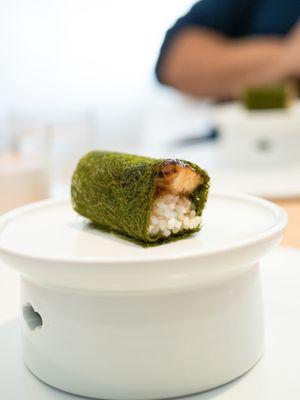 Live eel wrapped in gamtae seaweed