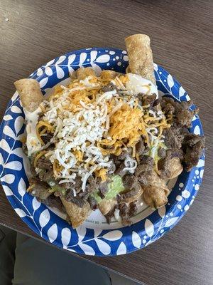 Taquitos supreme was huge with a lot of carne asada meat on top. Yummy! $8.99