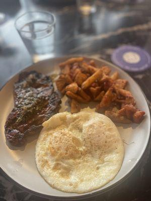 Steak and eggs with chimichurri and crispy home fries