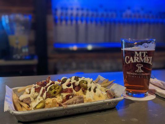 Loaded fries and Amber Ale, at the bar.