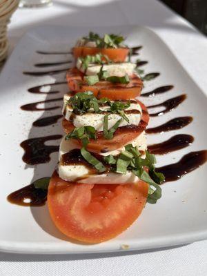 Caprese salad. Tomatoes tad underripe but paired well with my glass of pinto Grigio.