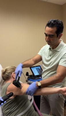 Dr. Filiberto performing Morpheus8 on arms for skin tightening.  Discover how our advanced procedures can rejuvenate your skin!