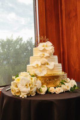 Our wonderful wedding cake. We provided our own florals. The cake and stand is from I Do Wedding Cakes.