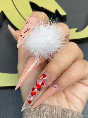 Stilleto shape long nails with cute pom nails. How cute is it!!!