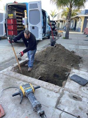 Exposing a broken sewer line.