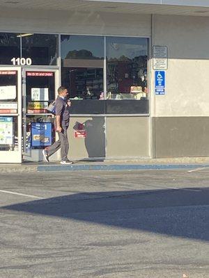 Left customers inside to go place his bag in his car. Returned and helped the waiting customers when he was done.