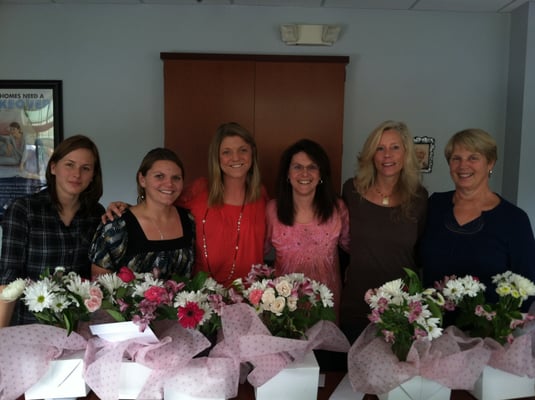 Operations staff with the flowers they got just because they are awesome!