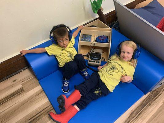 Enjoying the Listening Center in Pre-K.