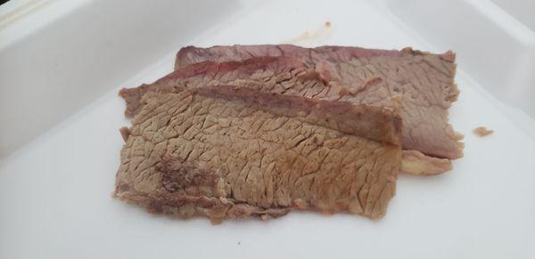 Brisket that has little to no smoke ring. Very sad. Not truly smoked on a real smoker.