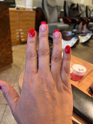 Manicure in red w/ a few French tips.