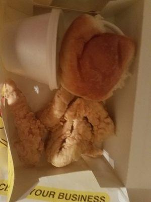 4 piece chicken strips with mashed potatoes and a roll