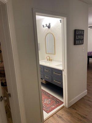 After photo of bathroom. Crew was able to install all vinyl planks with no transition pieces (except where tile meets vinyl plank flooring)