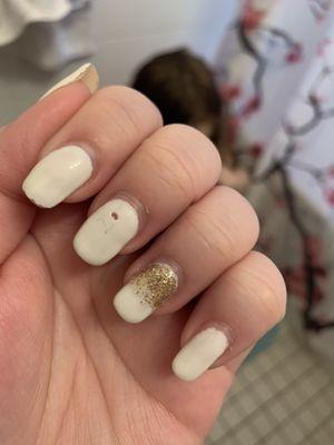 White gel manicure with a gold glitter gradient as the accent ONE week after