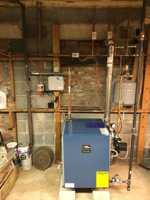 Installation of Utica 150 thousand BTU boiler with three zones